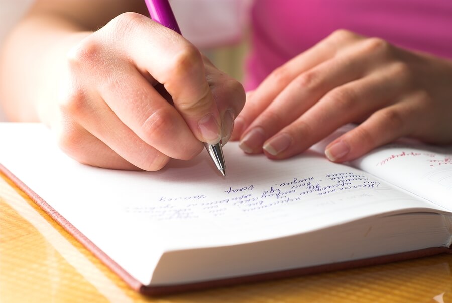 ADHD tips for parents, woman writing in journal