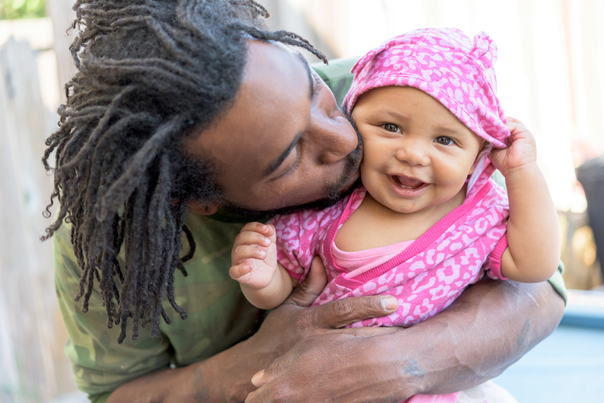 Jamaican baby girl with her father 