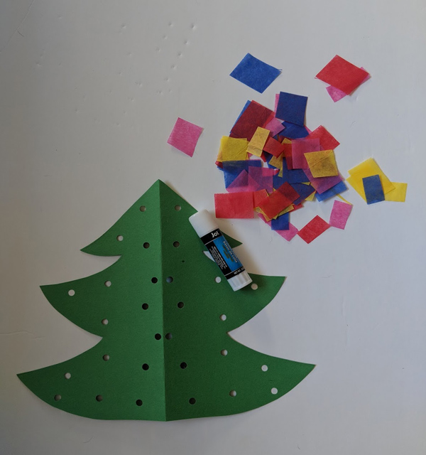 Picture of Paper Christmas Tree Cut Out craft with scattered tissue paper pieces