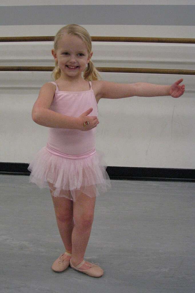Youg Girl Taking Ballet Class