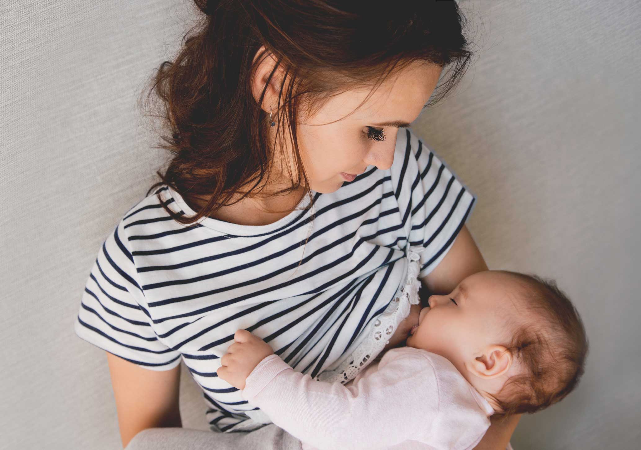 woman breastfeeding babies