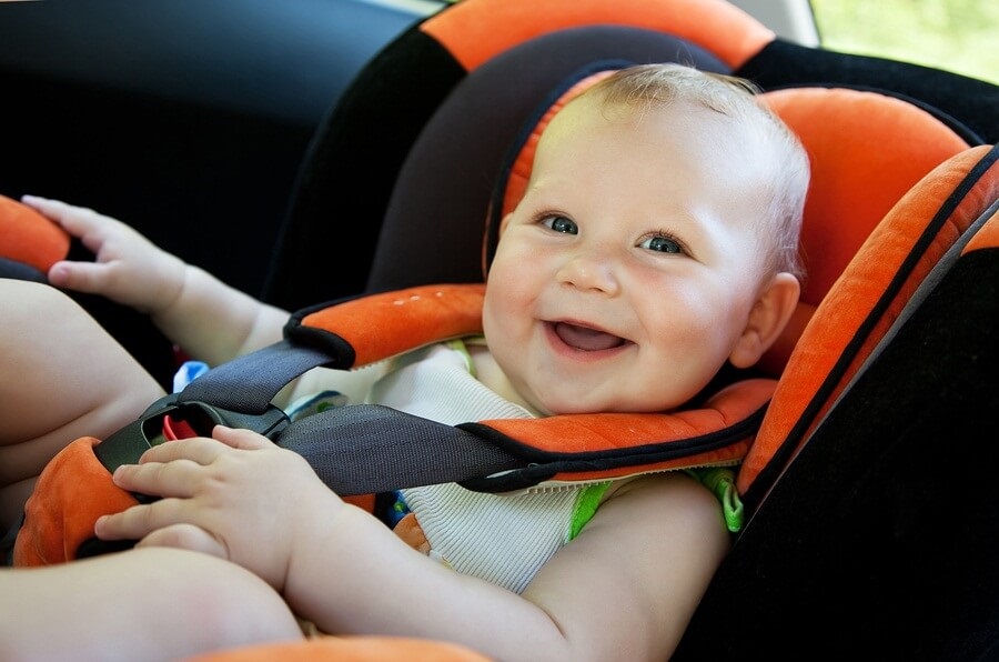 Happy baby in car seat