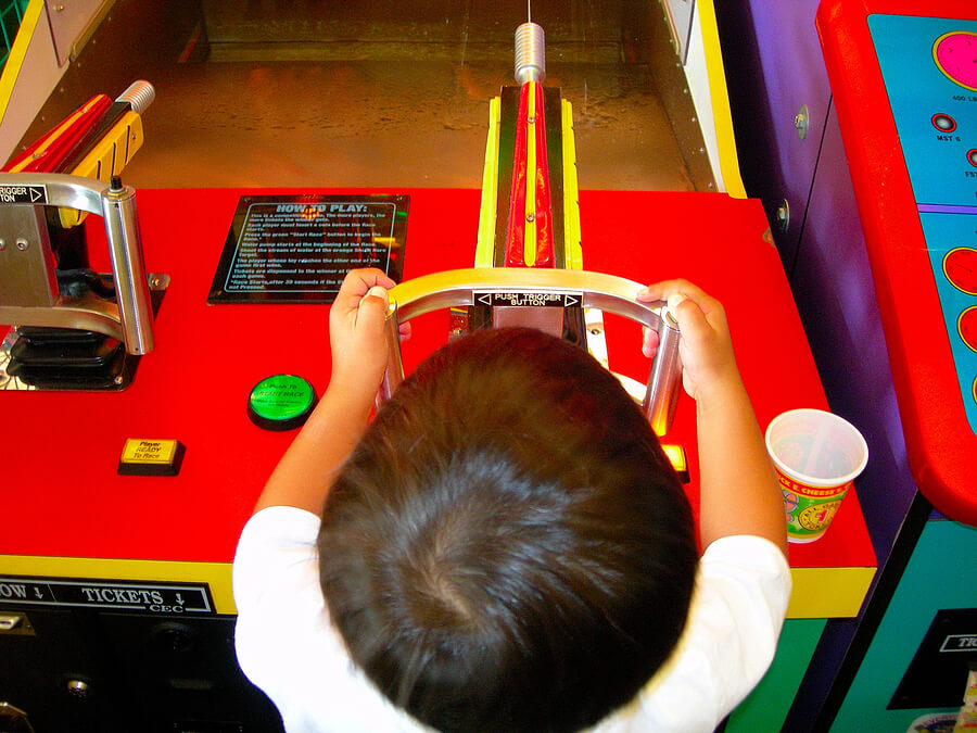 BoyPlayingintheArcade,Game