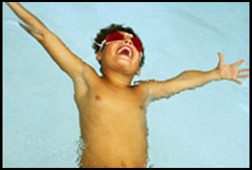 Boy floating in pool