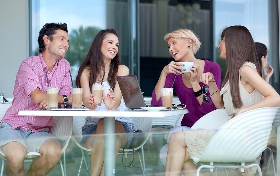 Group of young adults drink coffee