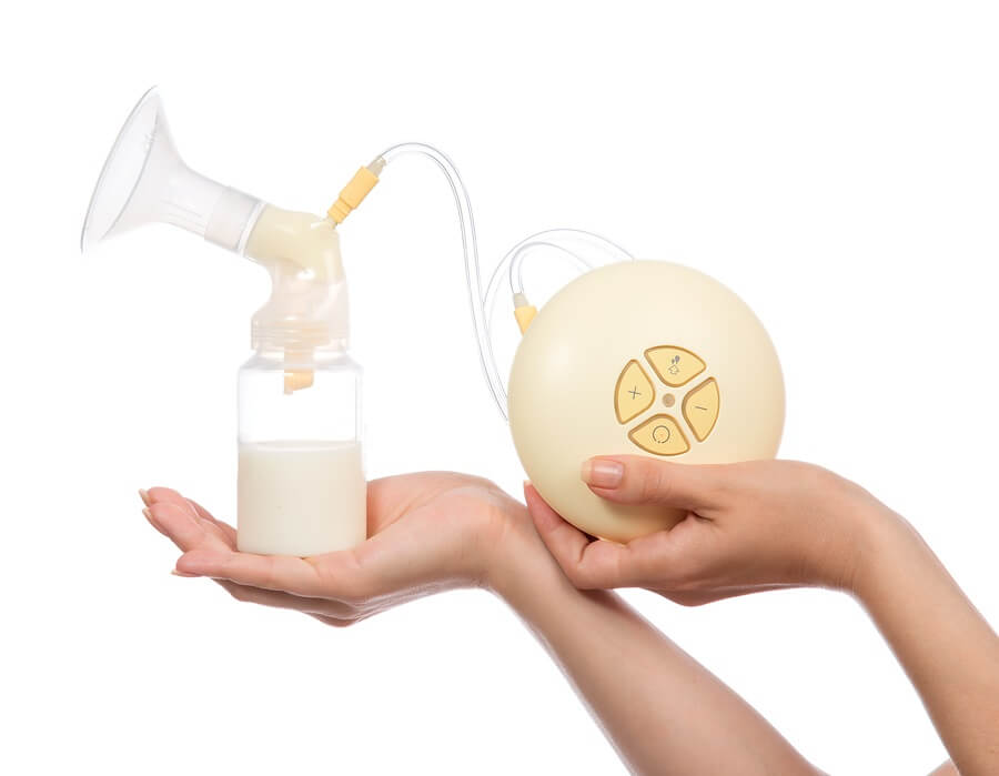 Electric breast pump on white background