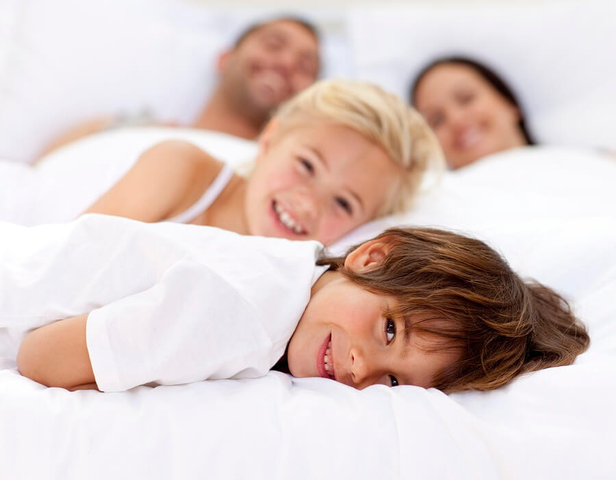 Parents and children in bed