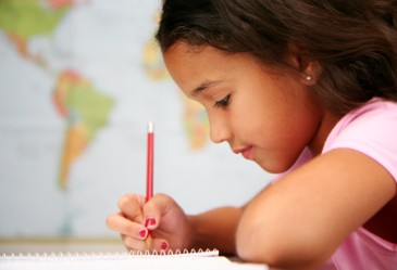 Closeup of young girl concentrating on school work.