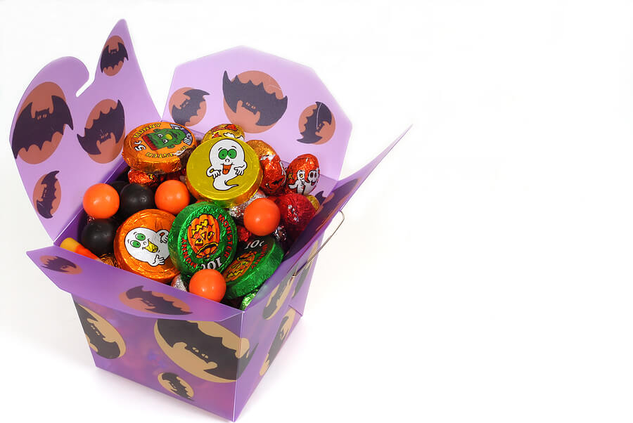 Halloween candy leftovers, party favor goody box filled with Halloween candy