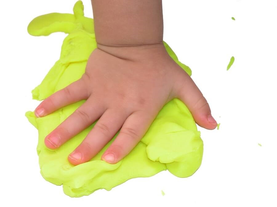 Child's hand in play dough
