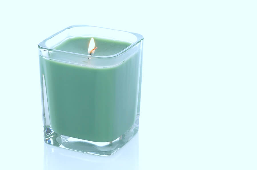 Lit green candle