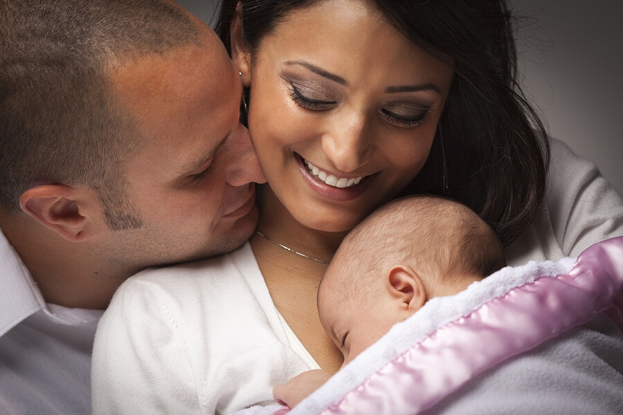 Happy couple with newborn baby