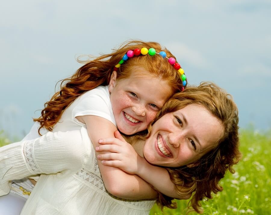 Smiling mother and daughter