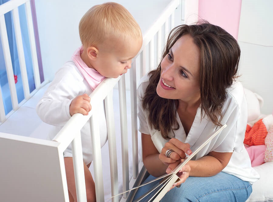 mom reading to baby at bedtime