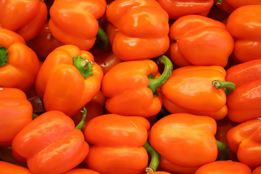 Close up of all orange bell peppers