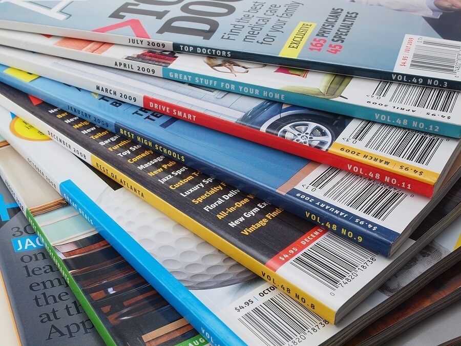 Pile of magazines against white back drop