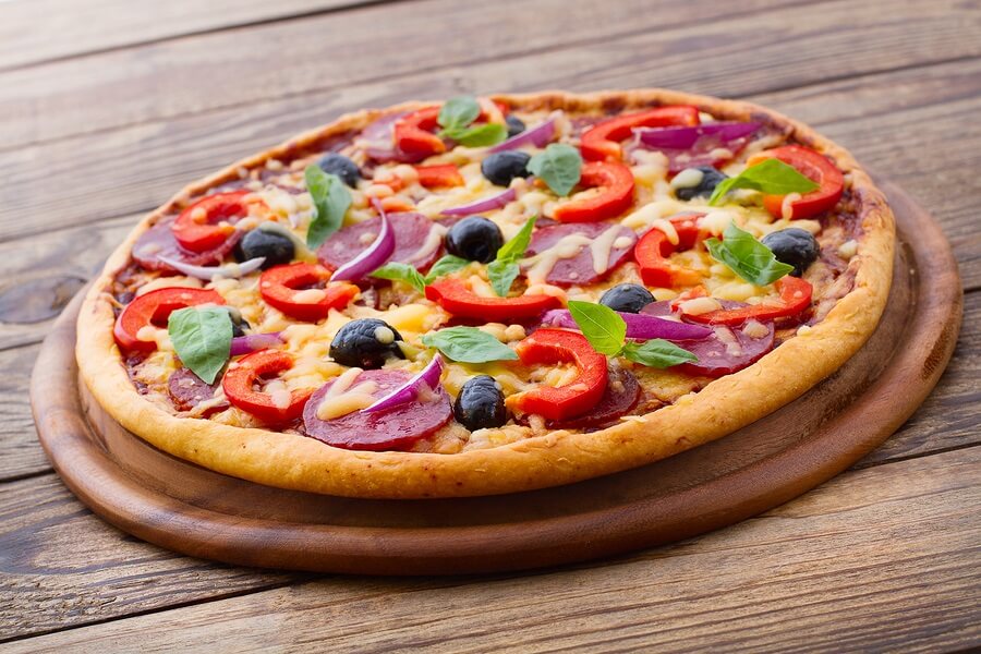 Pizza topped with colorful vegetables