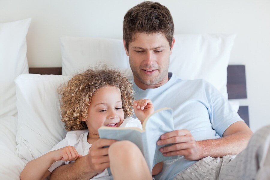 Father reading child bedtime story