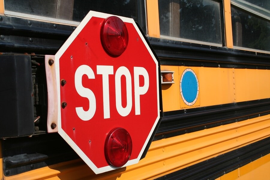 Close up of school bus stop sign