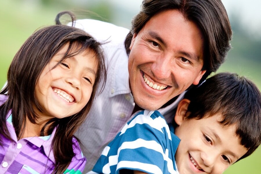 Smiling father and kids