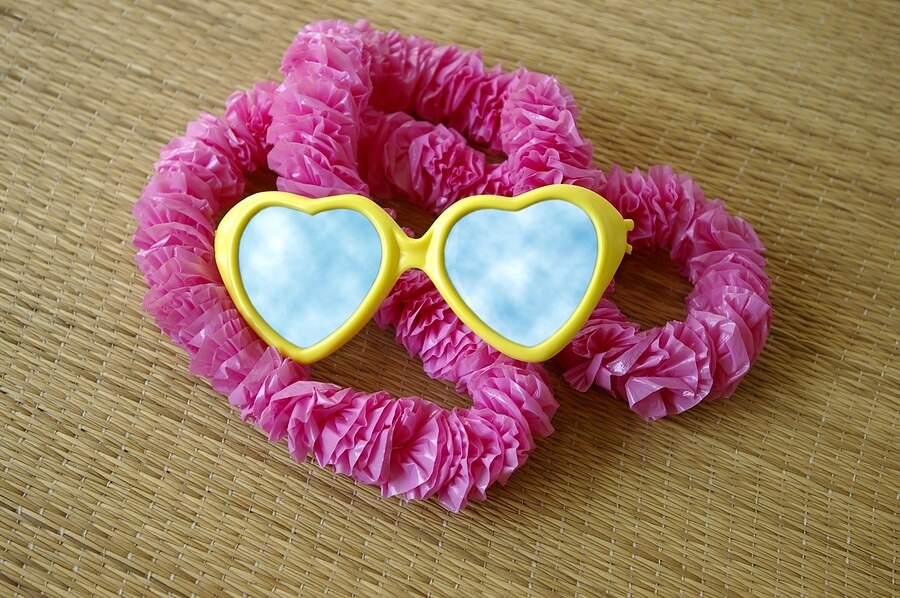 Lei and plastic heart sunglasses