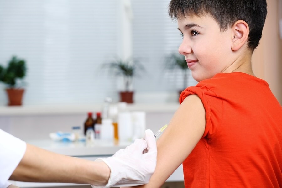 Young boy getting vaccine