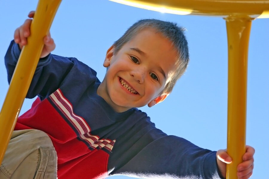 Young boy playing on playground