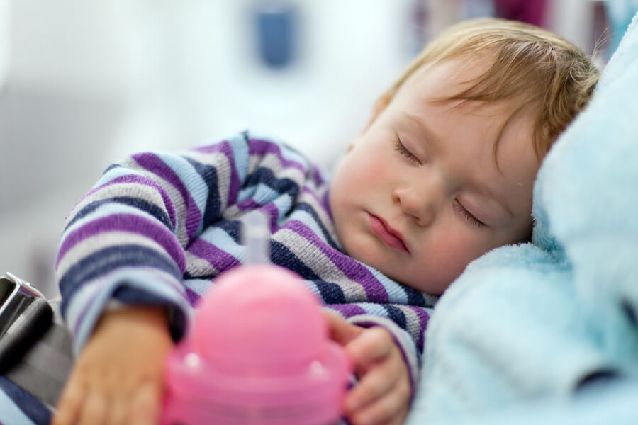 baby sleeping on plane