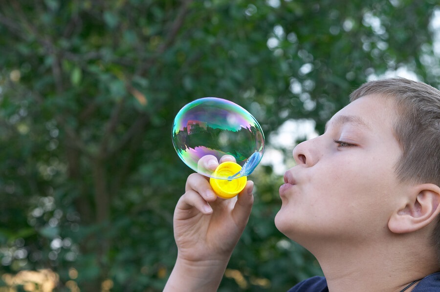 Boy Blowing Bubbles