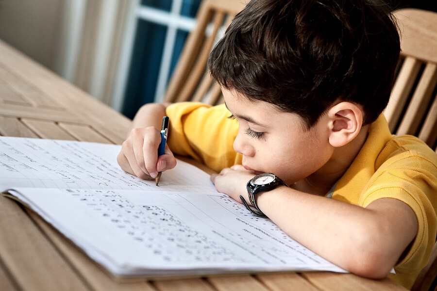 boy doing worksheets