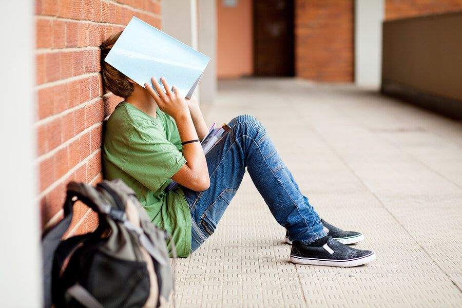 teen boy struggling in school
