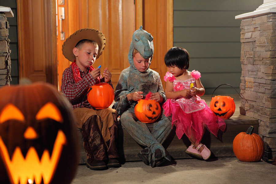 Halloween safety tip, kids sorting Halloween candy