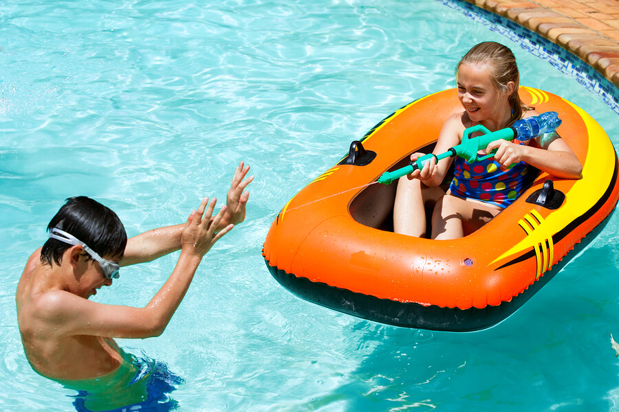 children playing with water guns