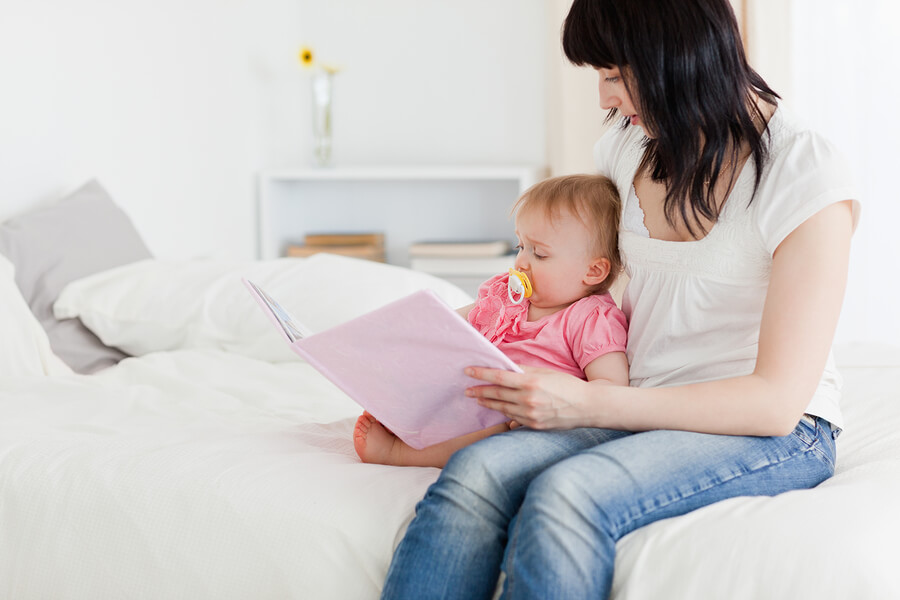 mother reading baby bedtime story