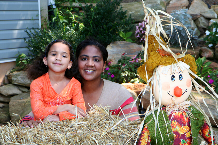 mom and child with Halloween decorations