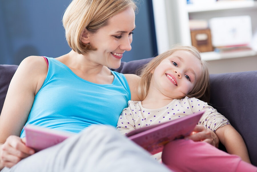 mother, daughter read sex ed book