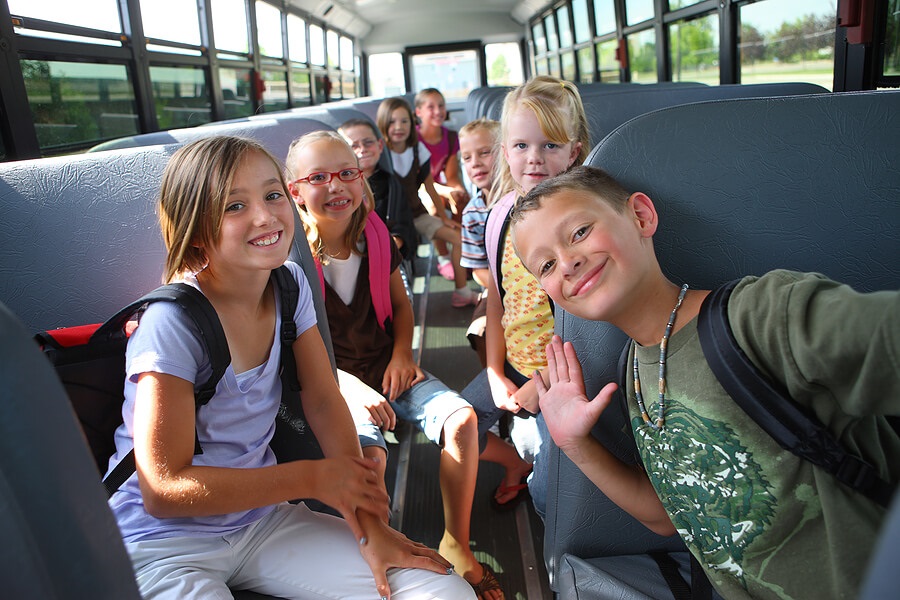 End of School Year, boys and girls on school bus