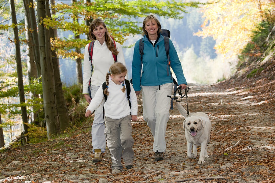 Fun Family Fitness, Moms and daughter hiking with dog for exercise