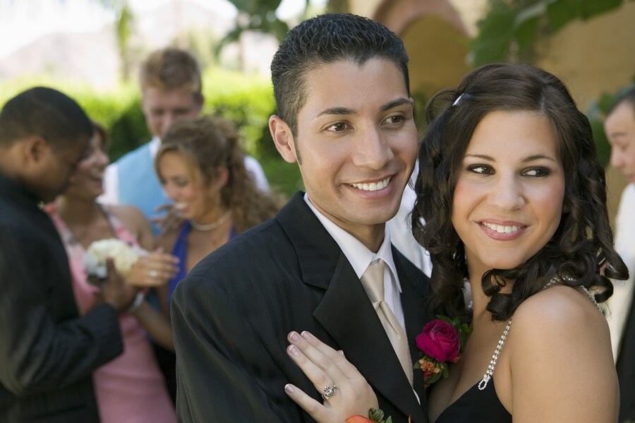 Smiling teen couple going to prom