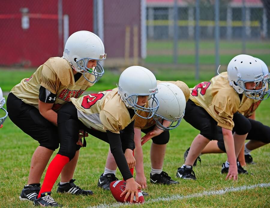 Young football players line of scrimmage