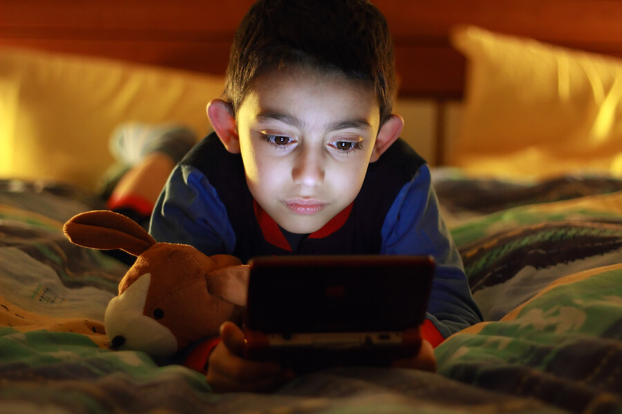 boy playing video game alone