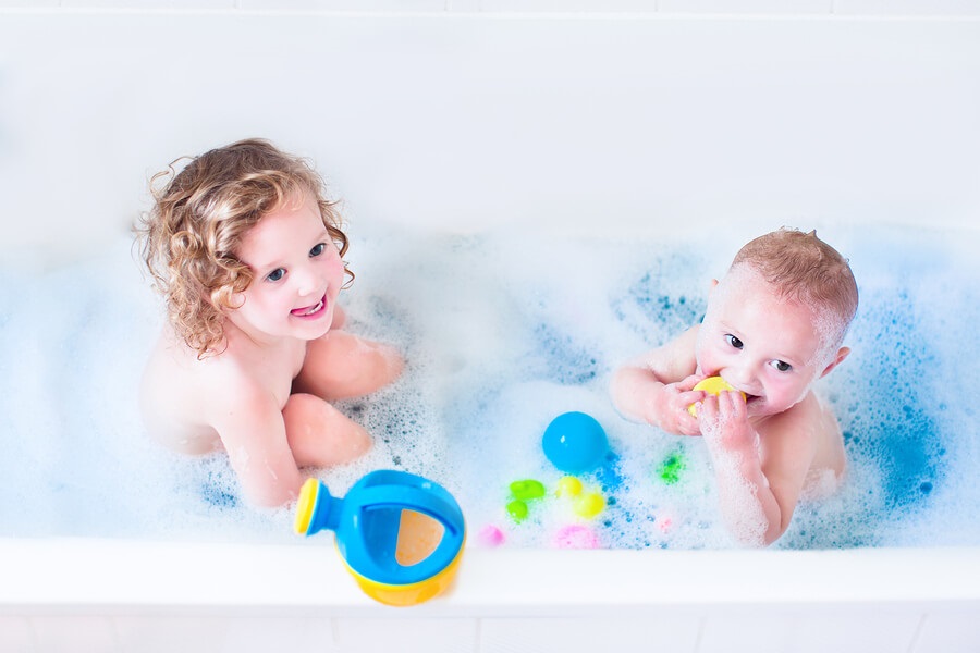 baby boy and toddler girl bath time