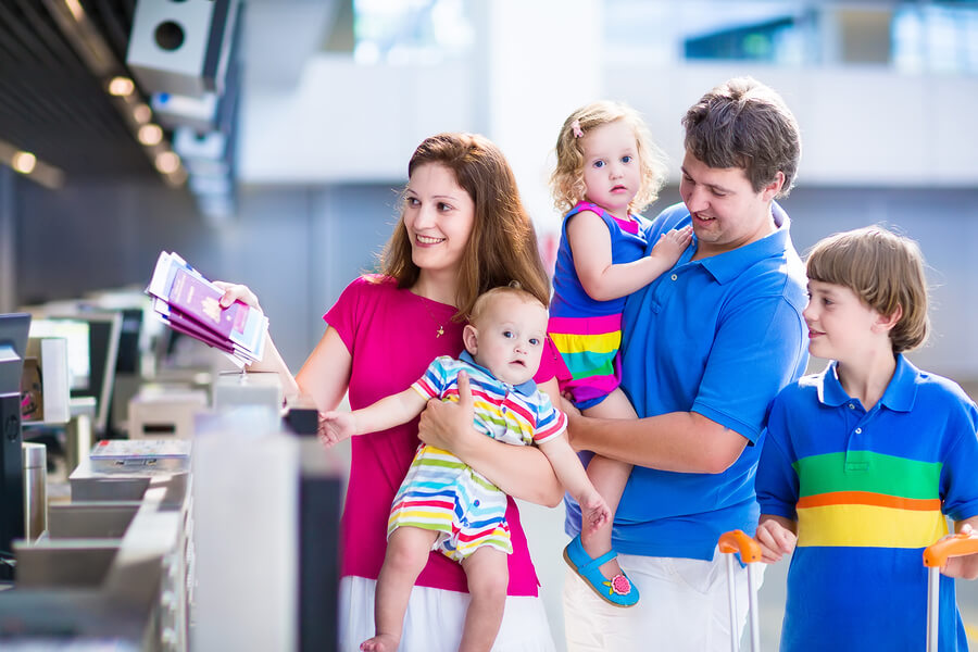 family with baby and toddler at airport