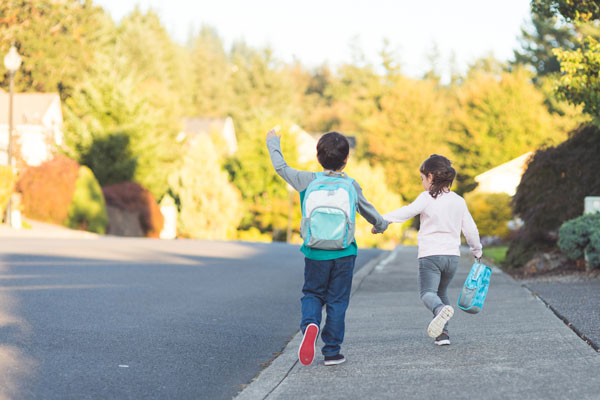independent kids walking to school