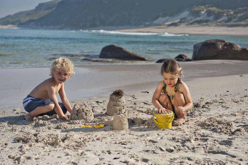 kids making a sandcastle