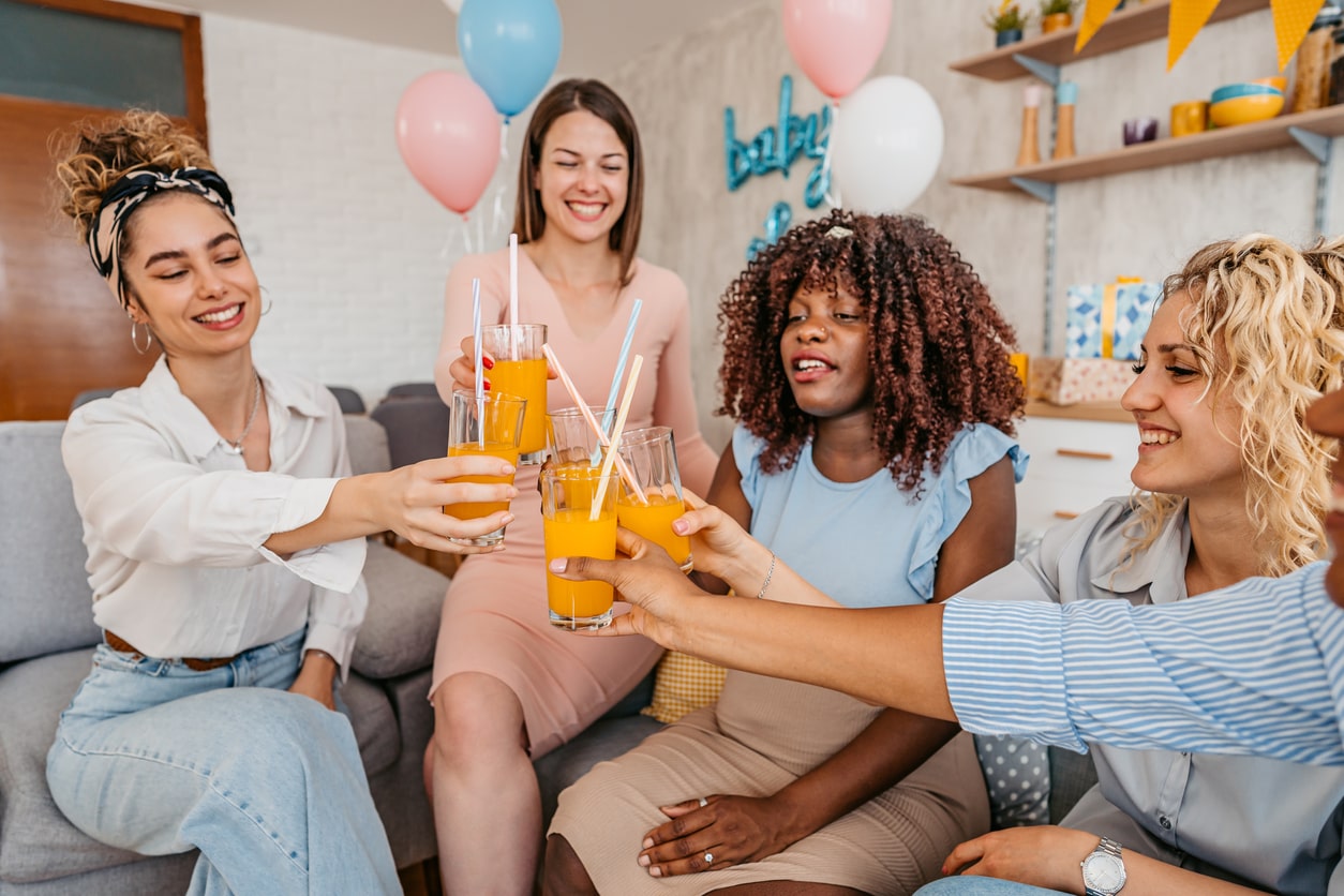 Group of women enjoy cocktails at baby shower