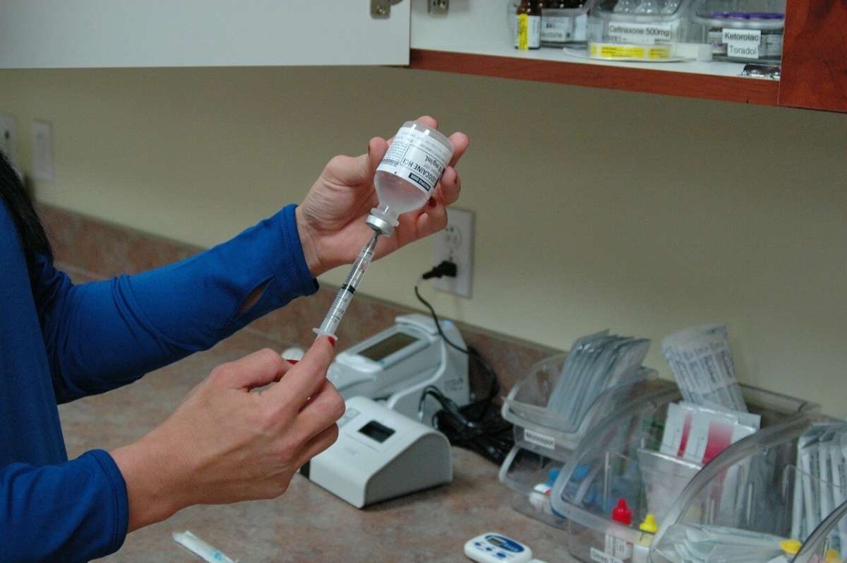 Doctor Prepping Vaccine Needle