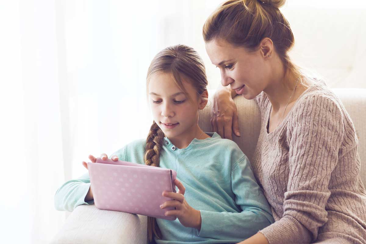 Mom and teen using tablet