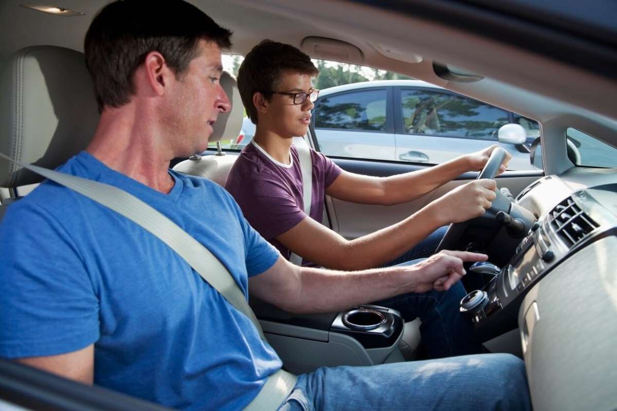 Teen Son Learning to Drive with Father