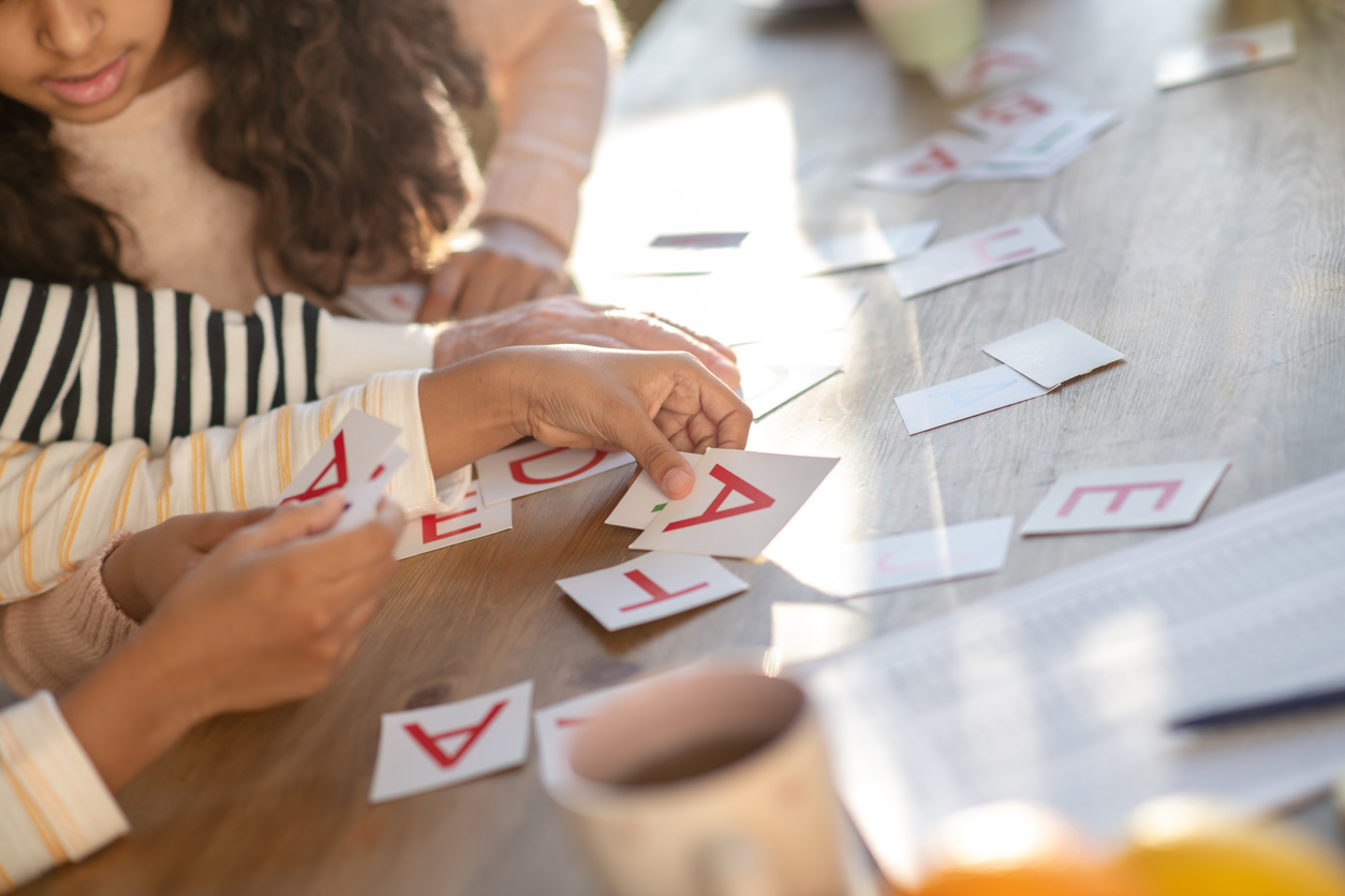 Close up picture of human hands putting the cards on the table stock photo